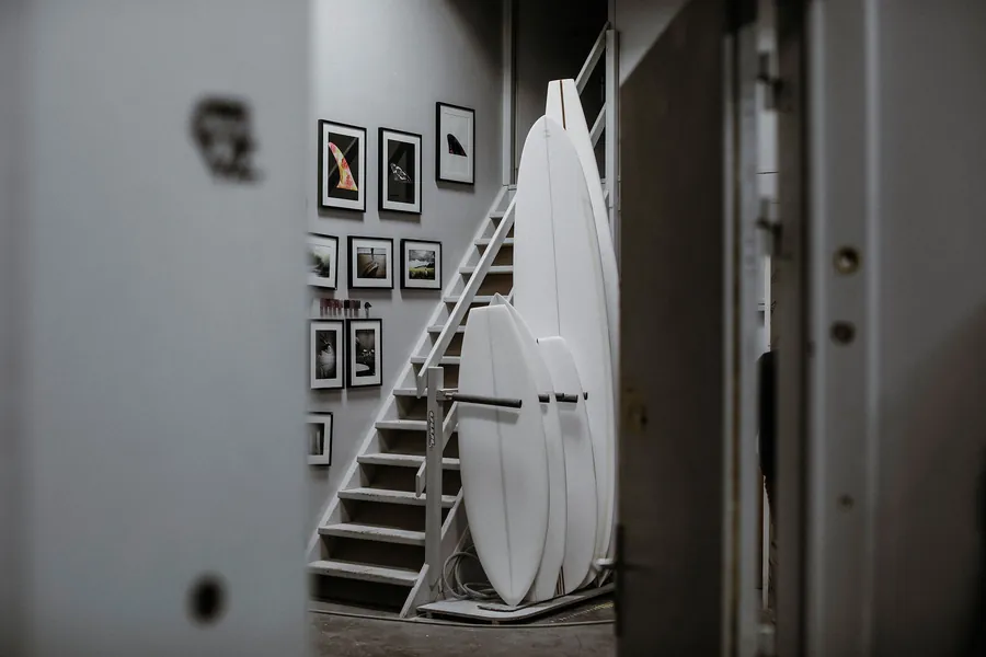 Longboards waiting inside the Martin Shapes workshop